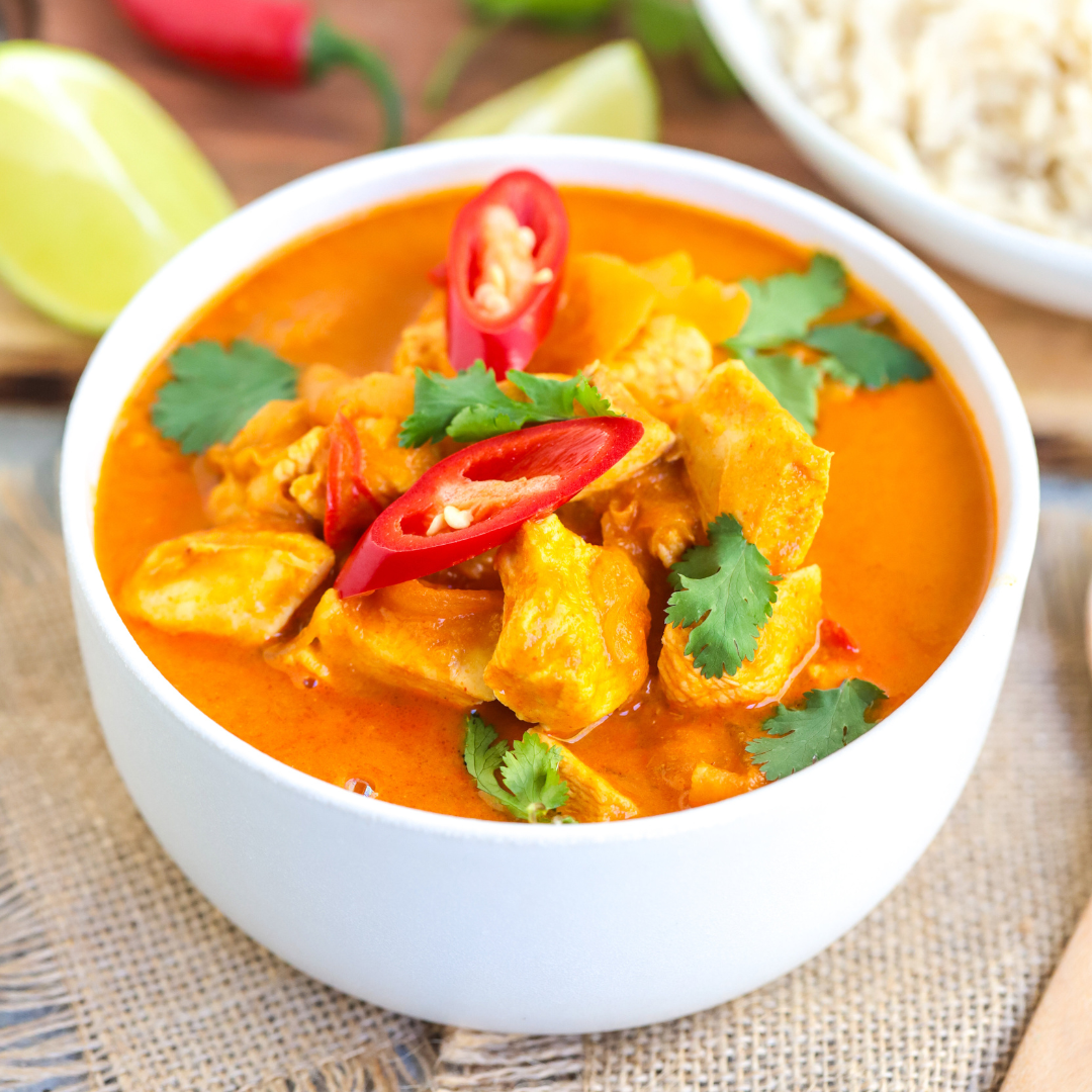 delicious mango chicken curry in a small white ball