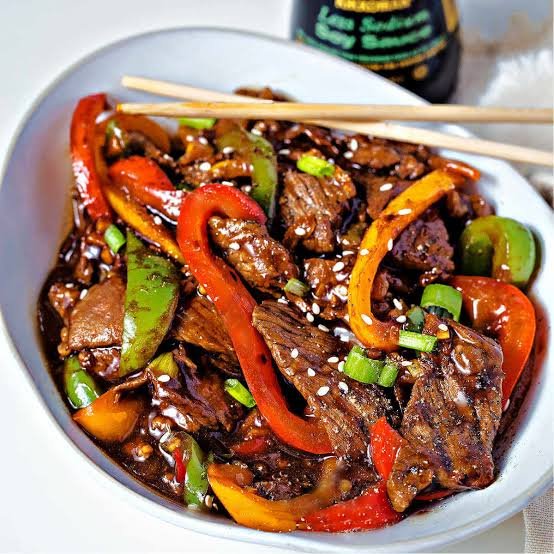beef onion stir fry with green and red peppers