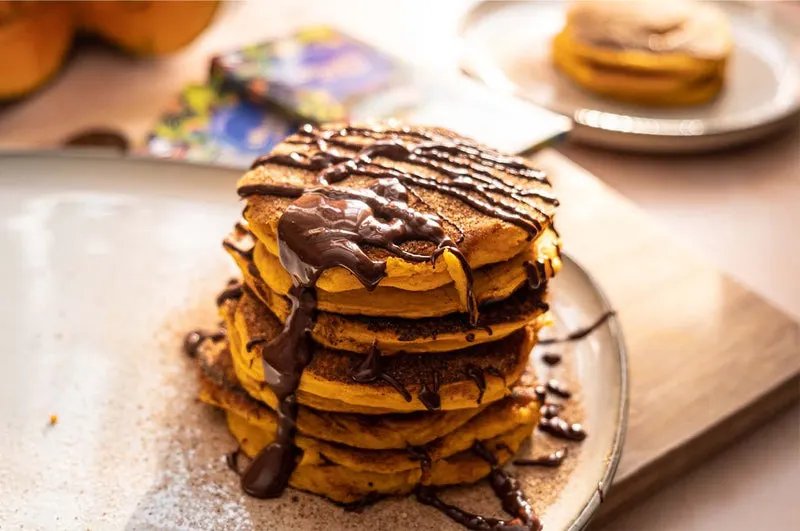 homemade  dark chocolate pumpkin fritters served on a platekin