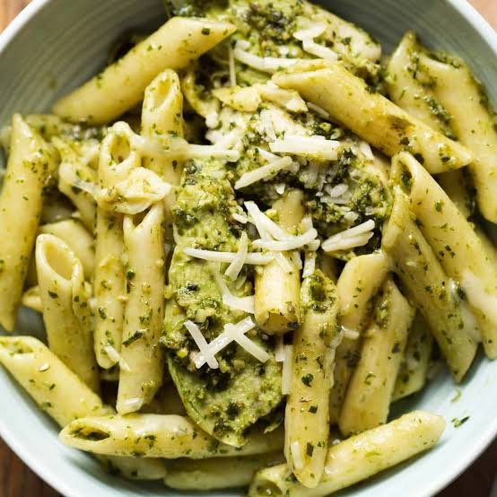 upclose photo of chicken peso pasta with grated parmeson cheese