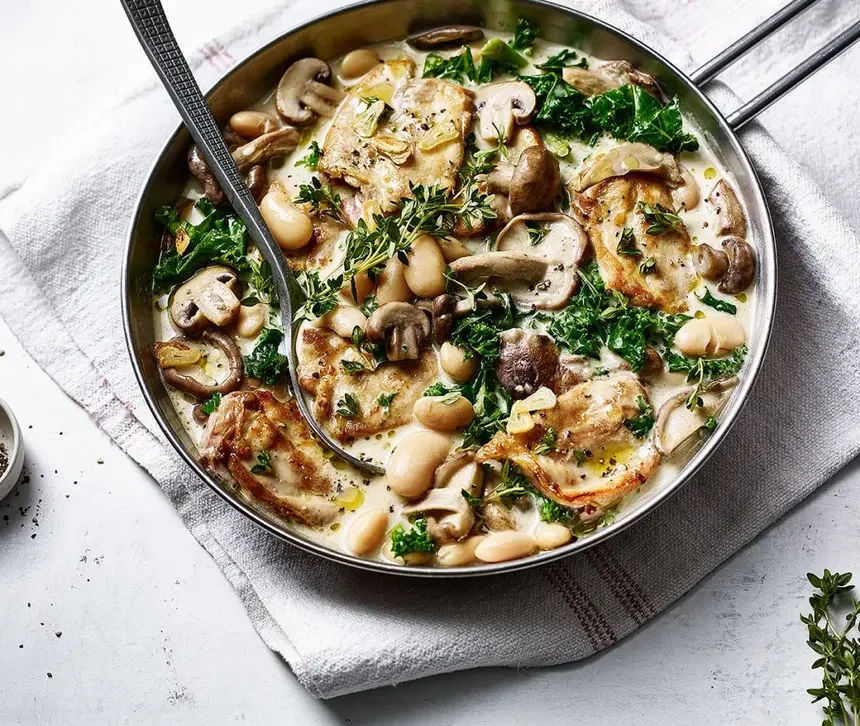 Homemade one pot chicken and mushrooms  served on table