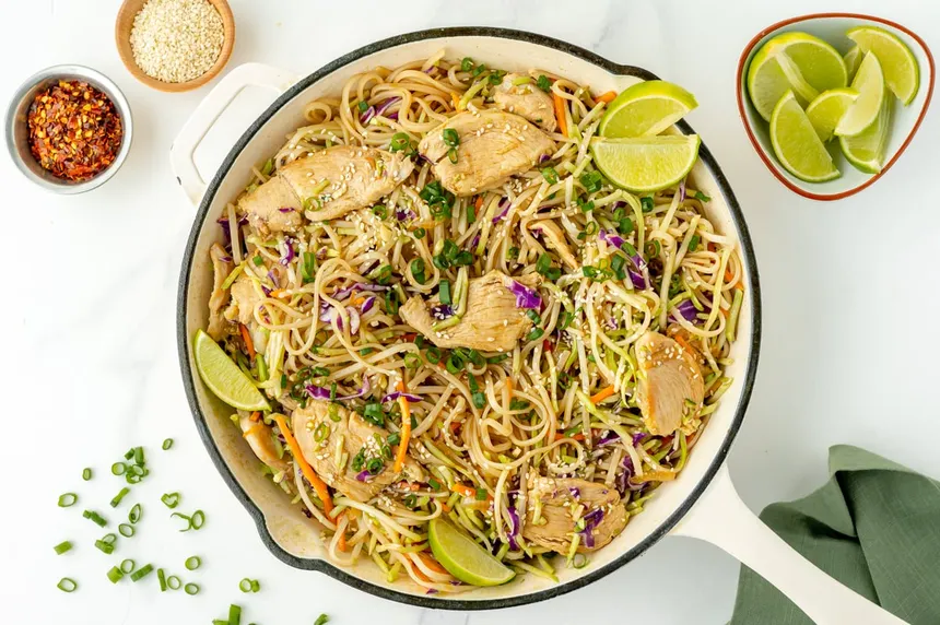 quick and easy chicken stir fry with noodles and fresh slices of lemon