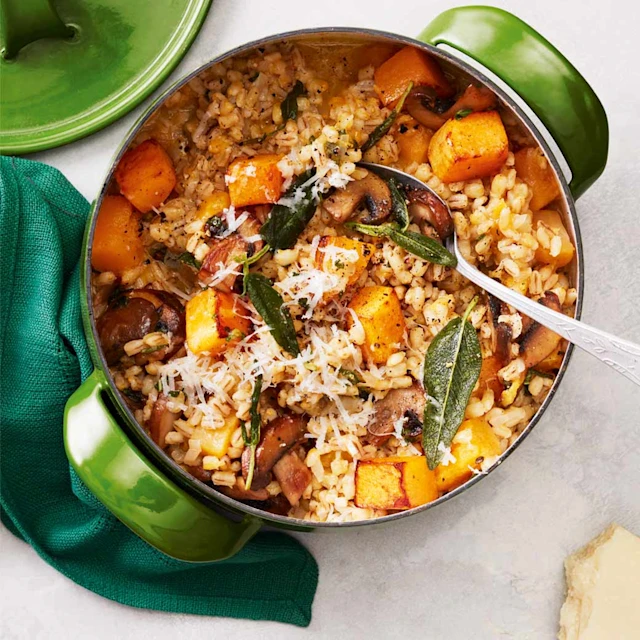 easy one pot butternut and barley risotto with mushrooms and sage served in a green pot on a table butternut barley 