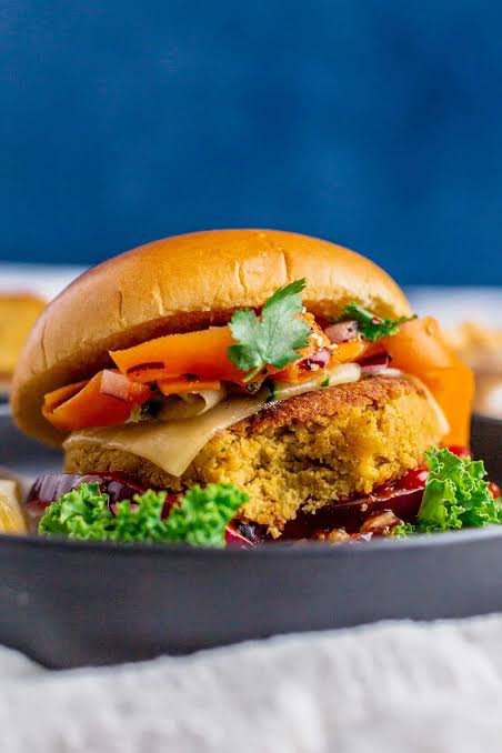 Homemade chickpea burger with cheese and tomato topping