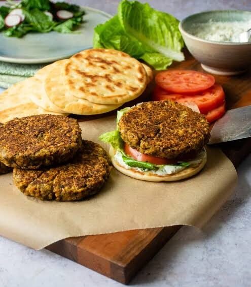 easy homemade chickpea burger served on pita bread with fresh tomatoes